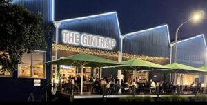 The best restaurant in Napier, The Gintrap is all lit up from the outside with LED string lights highlighting the iconic sawtooth roofline.